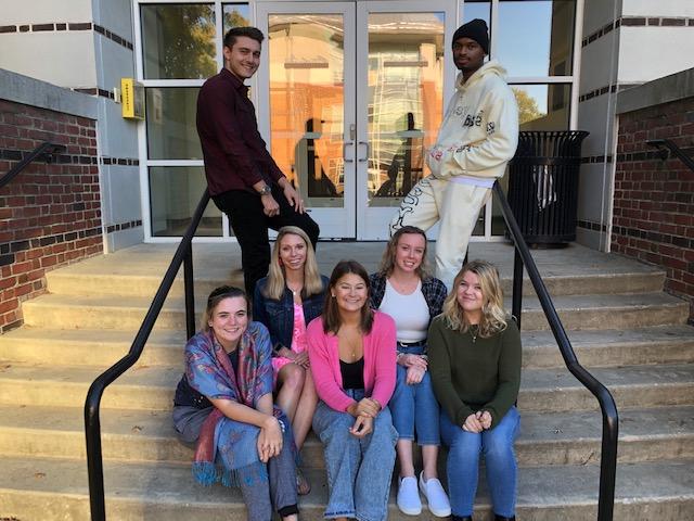 WAC-squared counselors pose on stairs